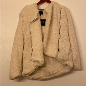 White fluffy jacket. Never worn. Perfect condition